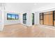 Sunlit living room featuring hardwood floors and expansive windows showcasing outdoor views at 1601 Park Ave # 307, Denver, CO 80218