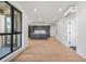Open living space featuring hardwood floors, modern kitchen, and a large window at 1601 Park Ave # 307, Denver, CO 80218