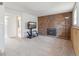Cozy living room with a brick fireplace, carpeted floors, and neutral paint at 9683 Josephine Pl, Thornton, CO 80229