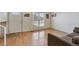 Bright living room featuring a large window, hardwood floors, and neutral decor at 9683 Josephine Pl, Thornton, CO 80229