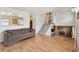 Spacious living room featuring hardwood floors, neutral decor, and staircase to upper level at 9683 Josephine Pl, Thornton, CO 80229
