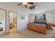 View of the main bedroom with en suite bathroom featuring wood details and natural light at 9683 Josephine Pl, Thornton, CO 80229