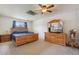 Bright main bedroom with wood furniture, ceiling fan and light, and a sky light at 9683 Josephine Pl, Thornton, CO 80229