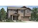 Charming two-story home with a two-car garage and nicely landscaped front yard at 6341 Las Palmas Pt, Parker, CO 80134