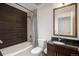 Bathroom with tub-shower combination, modern vanity, and updated fixtures at 891 14Th St # 3415, Denver, CO 80202