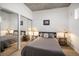 Cozy bedroom with mirrored closet doors and two bedside lamps at 891 14Th St # 3415, Denver, CO 80202