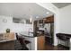 Modern kitchen featuring dark countertops, stainless steel appliances, and an island with barstool seating at 891 14Th St # 3415, Denver, CO 80202