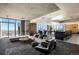 Modern open floor plan with a seating area, game tables, and city views at 891 14Th St # 3415, Denver, CO 80202