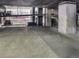 Parking garage with multiple vehicles and numbered parking spots at 891 14Th St # 3415, Denver, CO 80202