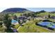 This is an aerial view of the community center with pool, sports fields, and parking, all against a mountain backdrop at 11894 Elk Head Range Rd, Littleton, CO 80127