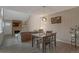 Cozy dining room showcasing hardwood floors and an adjacent living space at 11894 Elk Head Range Rd, Littleton, CO 80127