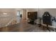 Open loft area ideal for a home office or entertainment space, featuring modern flooring at 11894 Elk Head Range Rd, Littleton, CO 80127