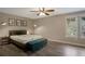 Bright bedroom with a large window, stylish furnishings, and a serene atmosphere at 11894 Elk Head Range Rd, Littleton, CO 80127