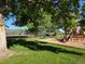 This community playground has mature shade trees, play equipment, and sports fields, all with mountain views at 11894 Elk Head Range Rd, Littleton, CO 80127