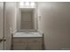 A conveniently located powder room with a new vanity at 11894 Elk Head Range Rd, Littleton, CO 80127