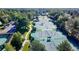 Aerial view of multiple tennis courts in the community with mature shade trees and ample parking at 11894 Elk Head Range Rd, Littleton, CO 80127