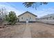 Backyard with a small yard, patio, and white fence at 3912 S Acoma St, Englewood, CO 80110