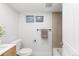 Bright bathroom featuring a tub/shower combo, updated fixtures, and a sleek tile surround at 3912 S Acoma St, Englewood, CO 80110