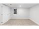 Bedroom with fresh carpeting, a window, and a closet with sliding doors at 3912 S Acoma St, Englewood, CO 80110