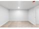 Empty bedroom features neutral carpet, white walls, and recessed ceiling lighting at 3912 S Acoma St, Englewood, CO 80110