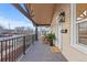 Inviting front porch featuring a cozy seating area, elegant lighting, and a welcoming entrance at 3912 S Acoma St, Englewood, CO 80110