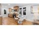 Bright kitchen and dining area featuring stainless steel appliances, white countertops, and modern finishes at 3912 S Acoma St, Englewood, CO 80110