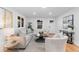 Well-lit living room showcasing a cozy seating arrangement, stylish décor, and hardwood floors at 3912 S Acoma St, Englewood, CO 80110