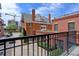 Balcony view showcasing brick buildings, a charming courtyard, and a vibrant urban setting at 410 Acoma St # 212, Denver, CO 80204