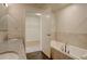 Bright bathroom featuring a soaking tub, separate shower, and granite vanity at 410 Acoma St # 212, Denver, CO 80204