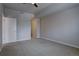 Empty carpeted bedroom with a ceiling fan, and a neutral palette for creating a personalized space at 410 Acoma St # 212, Denver, CO 80204