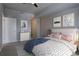 Comfortable bedroom with neutral tones, stylish decor, and cozy bedding creating an inviting atmosphere at 410 Acoma St # 212, Denver, CO 80204