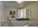 Modern bedroom with cozy blanket, decor, and a view into the hallway at 410 Acoma St # 212, Denver, CO 80204