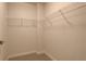 Walk-in closet with carpet, white walls, and open wire shelving for easy organization at 410 Acoma St # 212, Denver, CO 80204