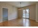 Bright dining room featuring hardwood floors, modern lighting, and sliding glass doors for natural light at 410 Acoma St # 212, Denver, CO 80204