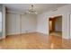 Open living room featuring wood flooring and modern chandelier lighting at 410 Acoma St # 212, Denver, CO 80204