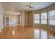 Spacious living area with wood floors, multiple windows, and recessed lighting at 410 Acoma St # 212, Denver, CO 80204