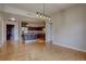 Open-concept space featuring a kitchen with stainless steel appliances and granite countertops adjacent to a dining area at 410 Acoma St # 212, Denver, CO 80204