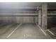 This parking garage features painted parking lines and concrete support pillars at 410 Acoma St # 212, Denver, CO 80204