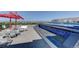 Rooftop pool and hot tub with mountain views and poolside seating at 410 Acoma St # 212, Denver, CO 80204