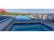 Rooftop pool with lounge chairs and stunning city views at 410 Acoma St # 212, Denver, CO 80204