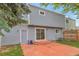 Back exterior of home featuring siding and a sliding glass door to patio at 19421 E Milan Cir, Aurora, CO 80013