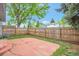 Fenced backyard featuring a concrete patio and grass yard at 19421 E Milan Cir, Aurora, CO 80013