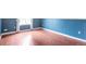 Bedroom with hardwood floors, base molding and patterned accent wall at 19421 E Milan Cir, Aurora, CO 80013