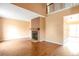 Spacious living room with wood floors, a cozy fireplace, and plenty of natural light at 19421 E Milan Cir, Aurora, CO 80013