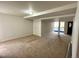 Finished basement with carpeting and view to kitchen at 10117 Granby St, Commerce City, CO 80022