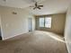 Spacious bedroom with neutral walls, standard ceiling fan, vaulted ceiling, and light-filled windows at 10117 Granby St, Commerce City, CO 80022