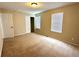 Bedroom featuring tan walls, carpeting, and natural light at 10117 Granby St, Commerce City, CO 80022