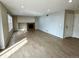 Living room with light-colored wood-look flooring and fireplace insert in light-colored decorative box above at 10117 Granby St, Commerce City, CO 80022