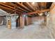 Spacious unfinished basement with exposed beams and concrete flooring at 265 S Pennsylvania St, Denver, CO 80209