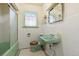 Bathroom featuring mint green fixtures and retro tile floor at 265 S Pennsylvania St, Denver, CO 80209